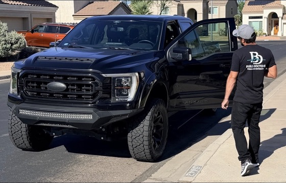 Build Doctors team member beside a company field truck in Arizona