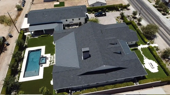 Finished residential roof and artificial turf viewed from above
