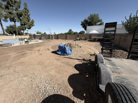 Arizona backyard prepared for artificial turf installation